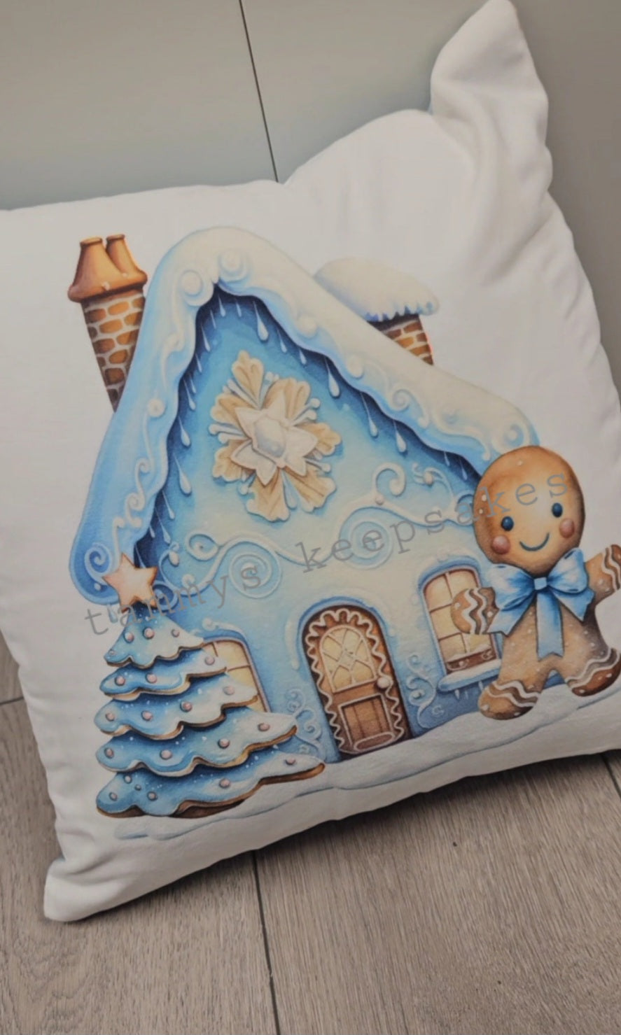 Blue gingerbread house cushion